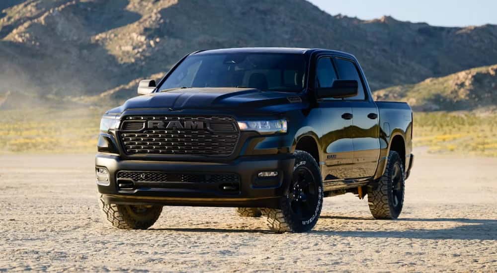 Black 2026 Ram 1500 parked off-road.