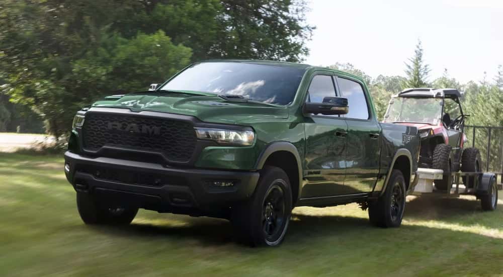 Green 2026 Ram 1500 driving off-road.