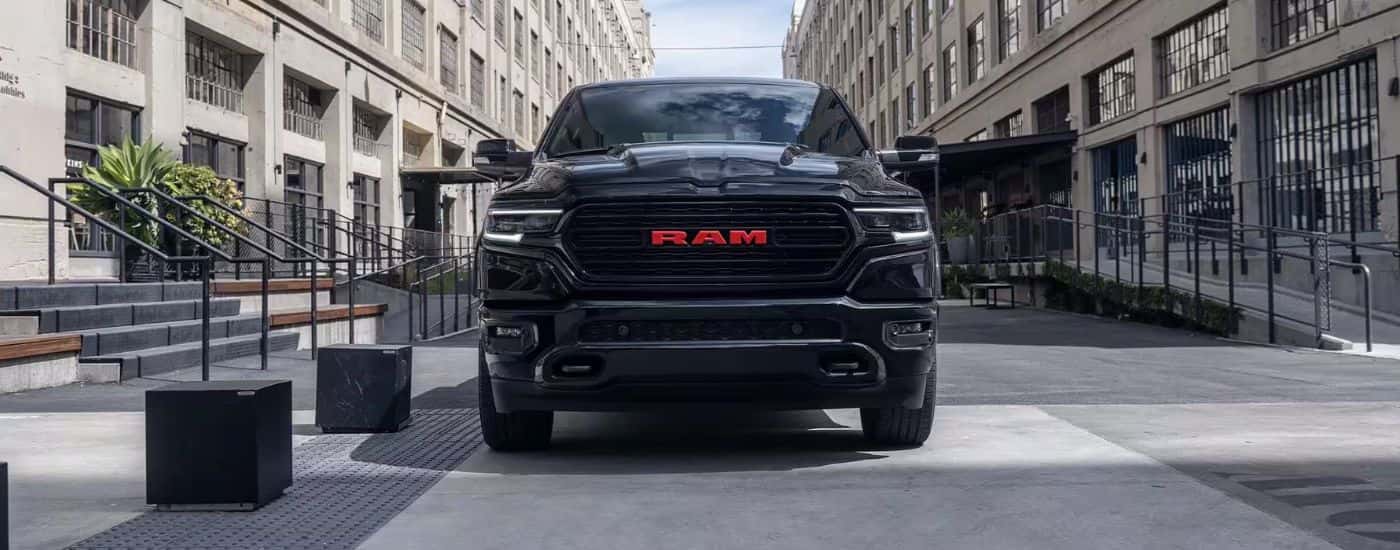 Black 2023 Ram 1500 Limited Red Edition parked head on