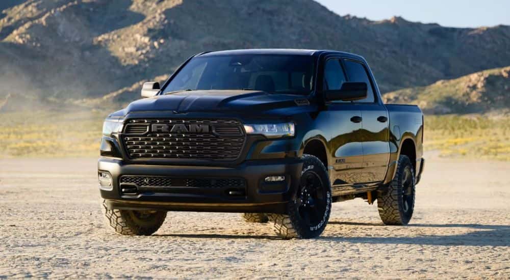 Black 2026 RAM 1500 Warlock edition parked in a desert