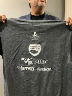 Victor Martinez Holds Up Shirt with Nucar Logo