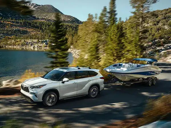 2026 Toyota Highlander towing a boat