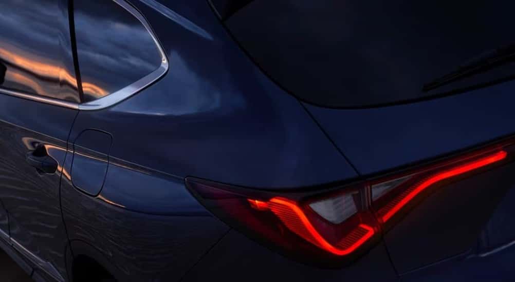 Close-up of a taillight on a blue 2026 Acura MDX.