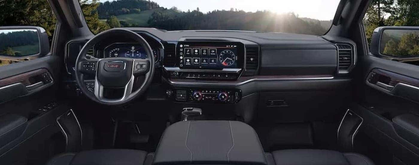 The black interior and dash in a 2023 GMC Sierra 1500 is shown.