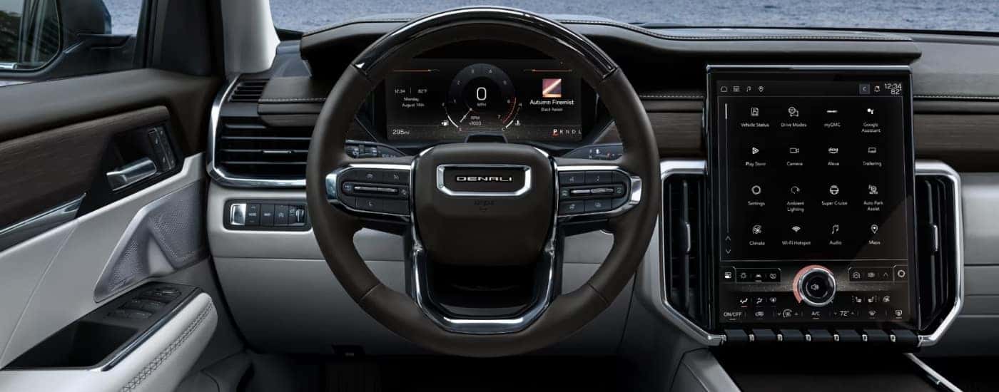 The black and grey interior in a 2024 GMC Acadia for sale near Winston-Salem.