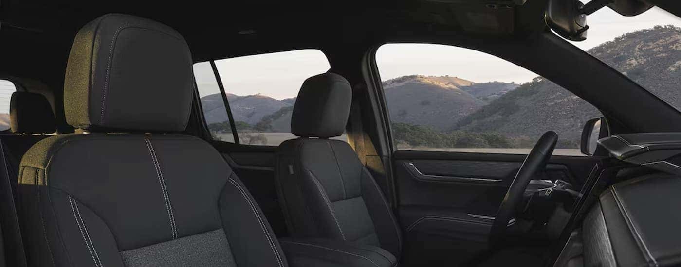 The black interior is shown in a 2025 GMC Acadia.