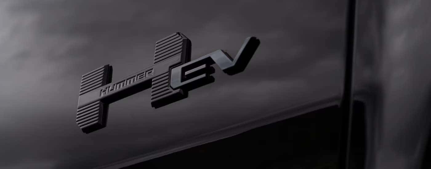 HEV badge on a black 2025 GMC Hummer EV for sale in Kernersville.
