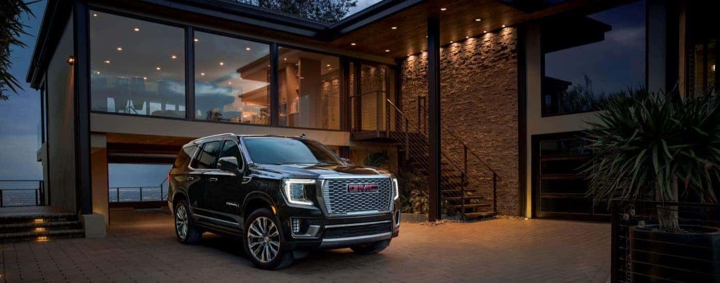 Black used 2023 GMC Yukon Denali for sale near Greensboro parked on a driveway.