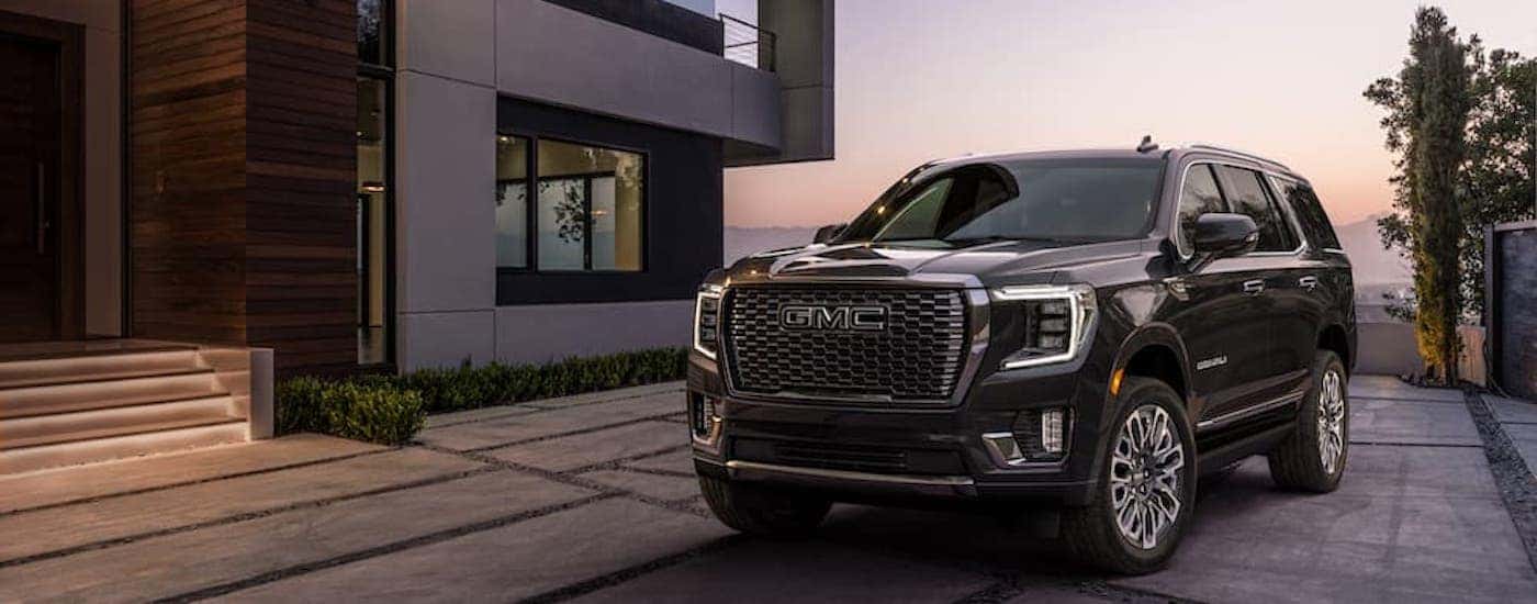 A black 2023 GMC Yukon Denali Ultimate from the front at an angle.