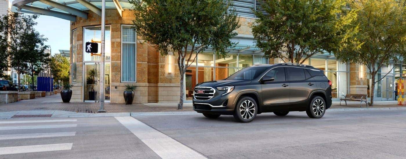Grey 2018 GMC Terrain SLT driving to a GMC dealer near Thomasville.