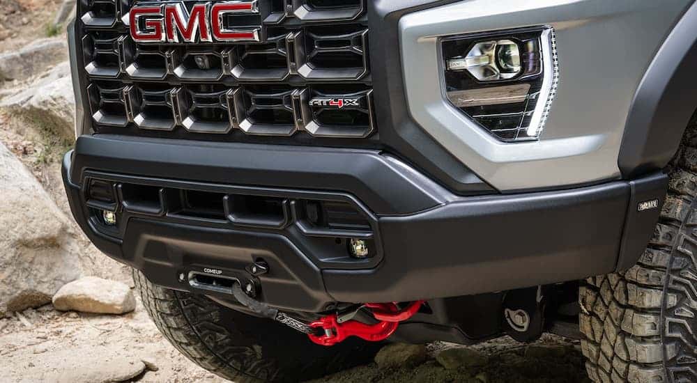 Close up of the grille on a silver 2025 GMC Canyon truck for sale