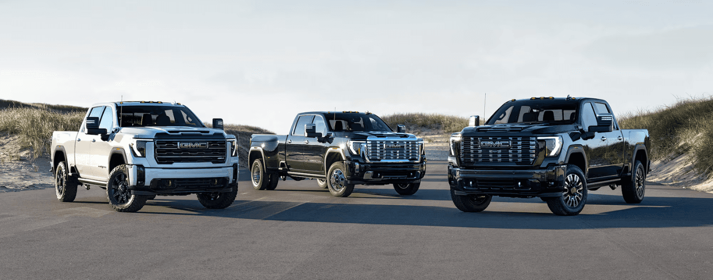 Three 2026 GMC Sierra HD parked side by side