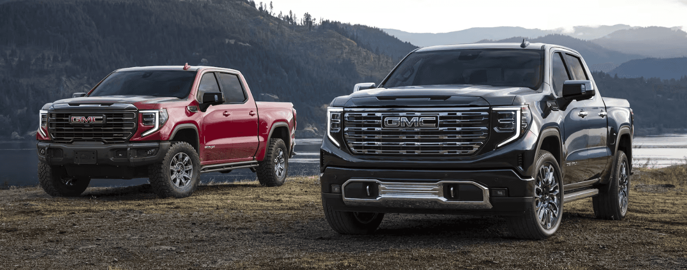 Two 2026 GMC Sierra 1500 parked off-road