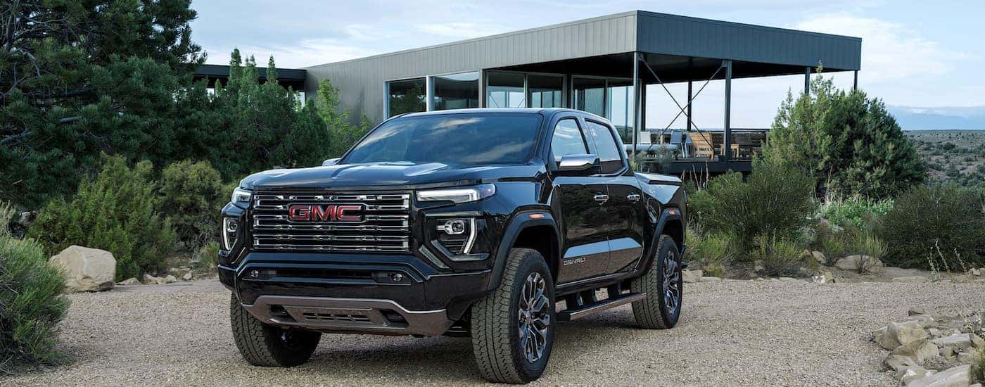 A black 2025 GMC Canyon from the front.
