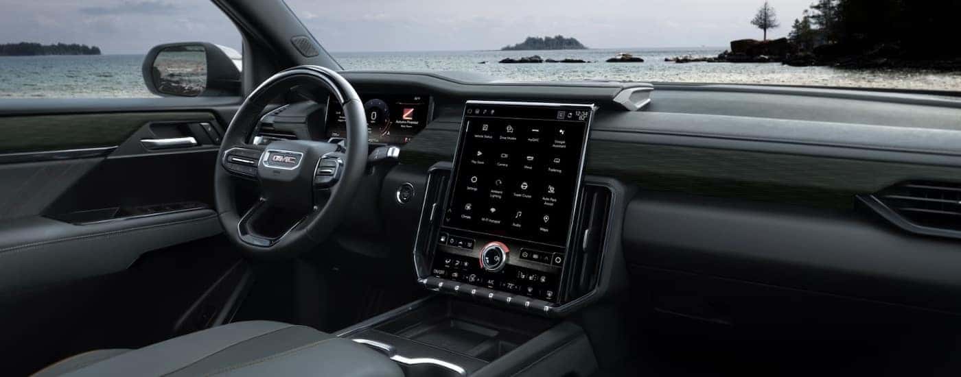 The black interior of a 2026 GMC Acadia.