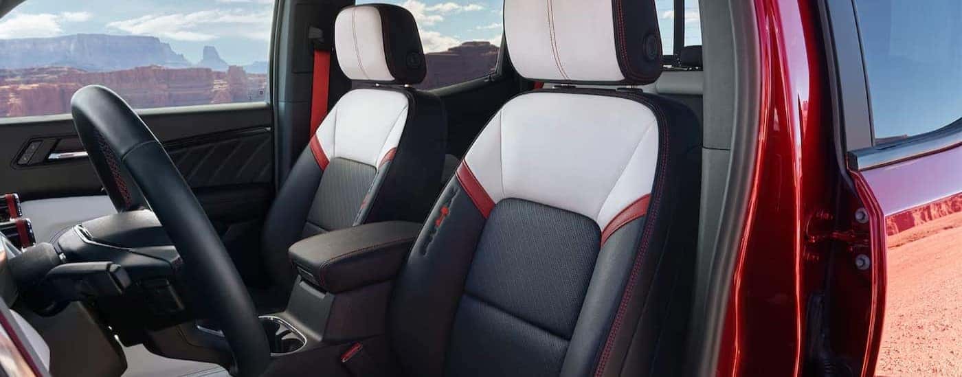 The black, white and red interior is shown in a 2024 GMC Canyon AT4X.