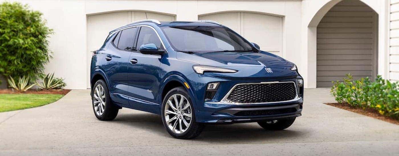 A blue 2024 Buick Encore Avenir is shown from the front at an angle.