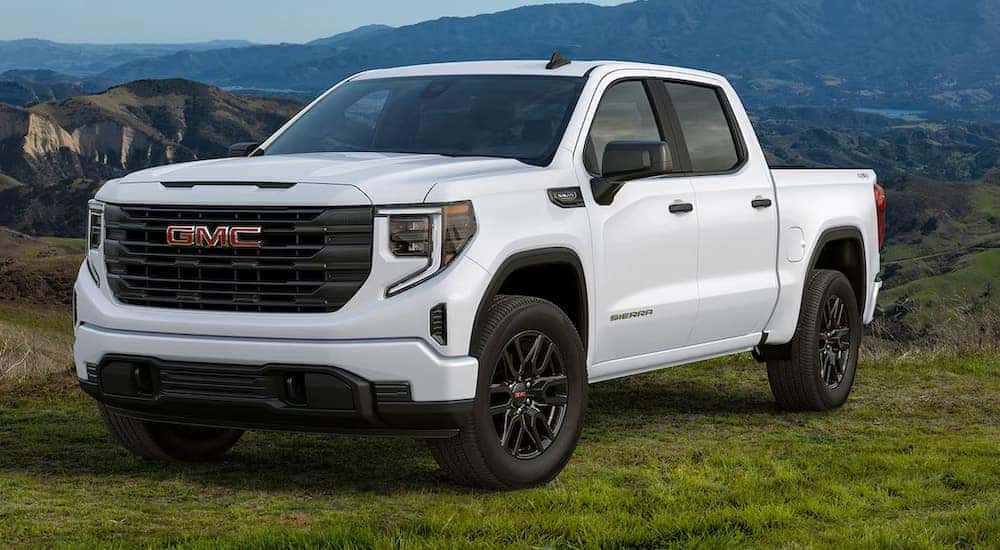 A white 2024 GMC Sierra 1500 Pro parked off-road off-road.