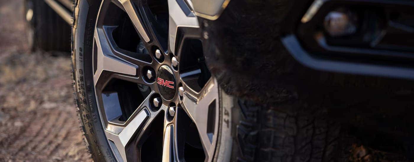 A close up of the rim on a grey 2025 GMC Yukon AT4.