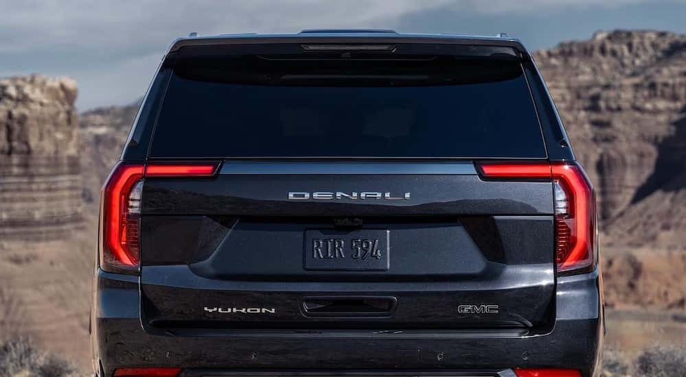 The rear-end is shown on a black 2025 GMC Yukon Denali.