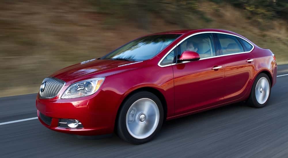 A red 2016 Buick Verano from the side.