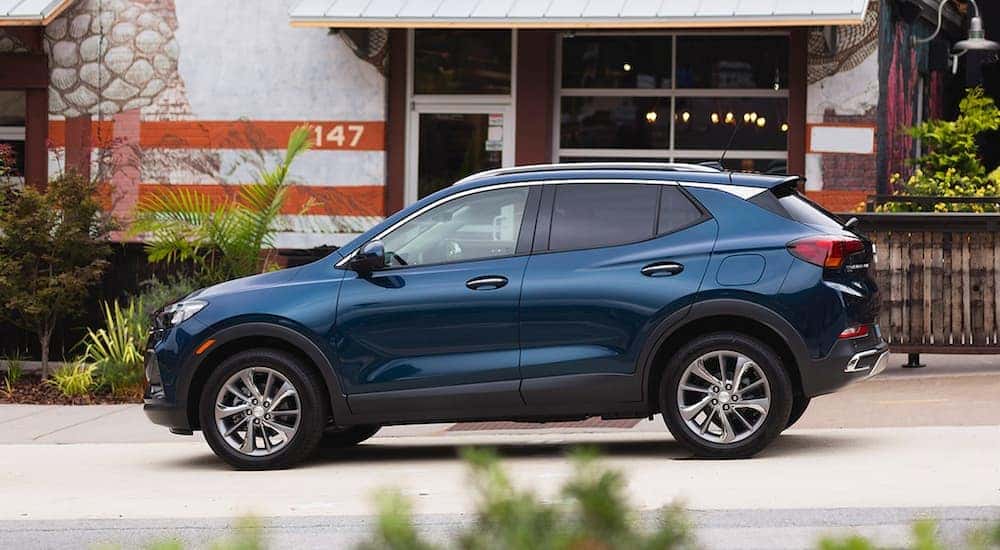 A blue 2020 Buick Encore GX parked in a city.