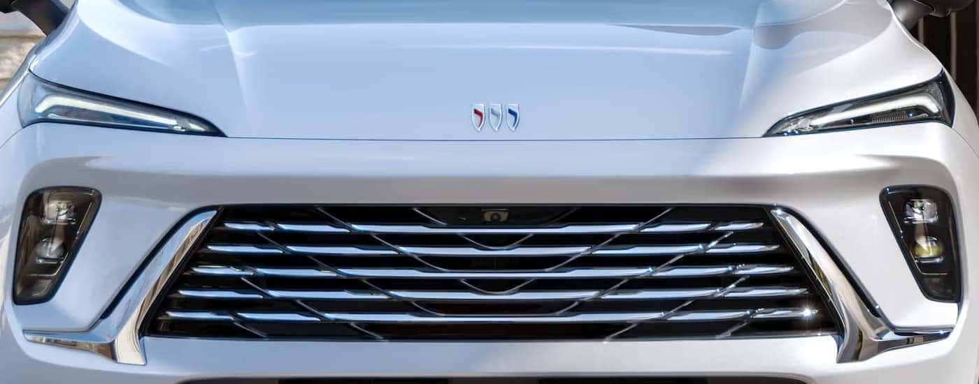 Front and grille on a white 2024 Buick Envision at a used Buick dealer.