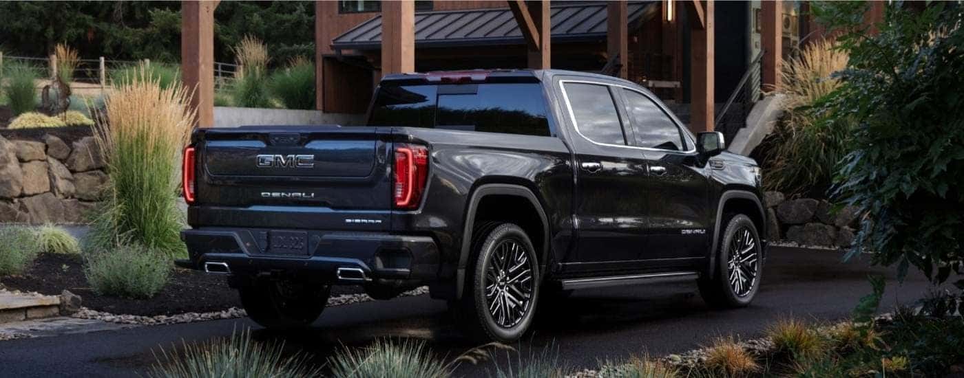 A black 2025 GMC Sierra 1500 for sale in Greenville from the rear.