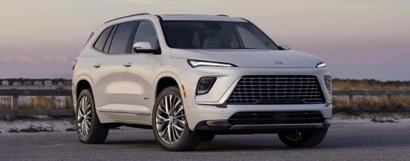 A white 2025 Buick Enclave Avenir on pavement.
