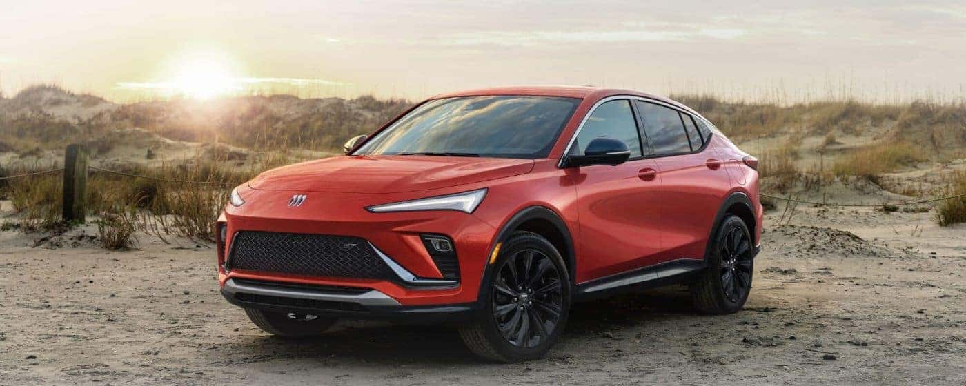 An orange 2024 Buick Envista ST is shown from the front at an angle after leaving a Buick dealer in Greenville.