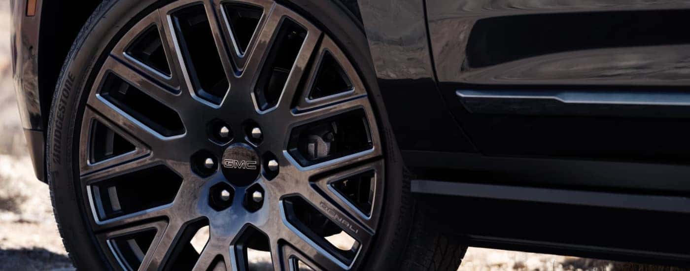 Black rim and tire on a 2025 GMC Yukon Denali for sale in Greenville