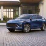 A blue 2025 Buick Envista Avenir parked in a driveway