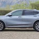 A silver 2025 Buick Envista Avenir parked off-road.