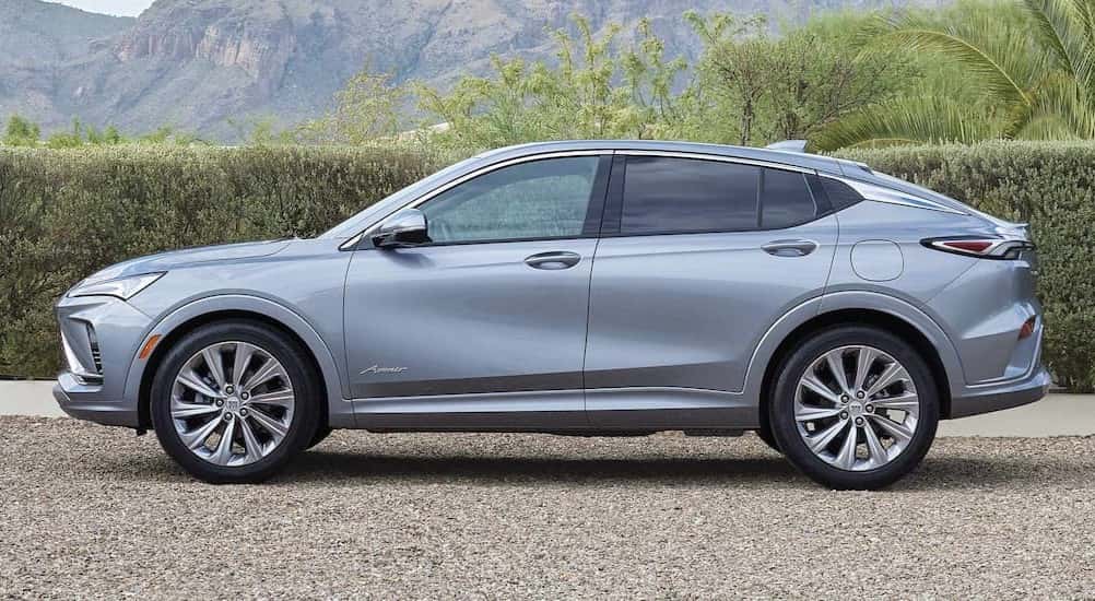 A silver 2025 Buick Envista Avenir parked off-road.