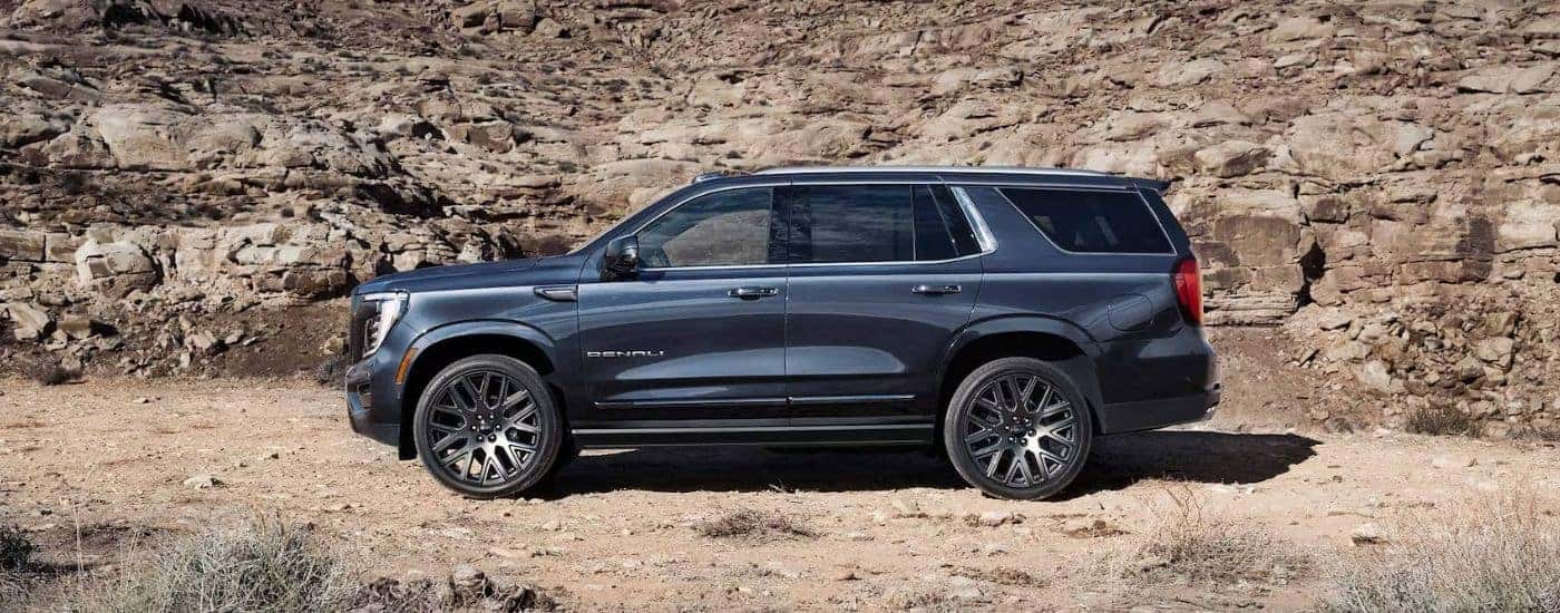 Side profile of a black 2025 GMC Yukon Denali