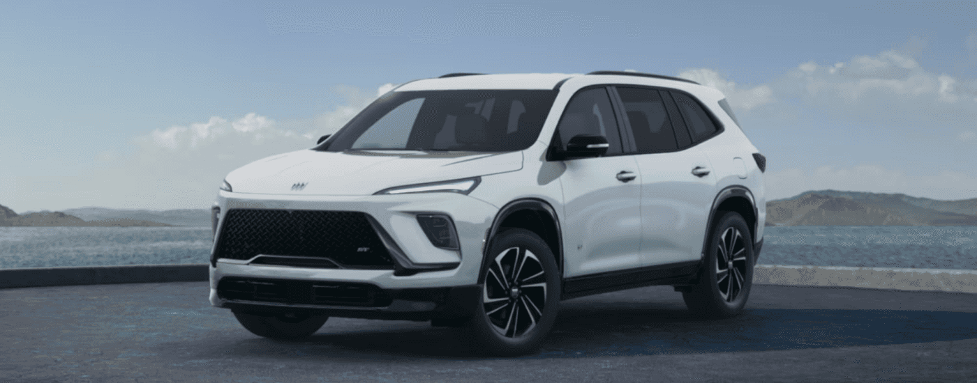 White 2026 Buick Enclave ST parked by water