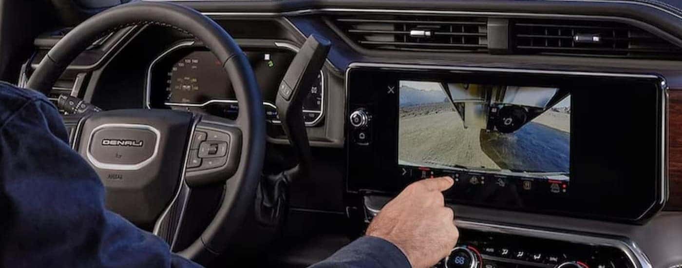 Steering wheel and infotainment screen in a 2025 GMC Sierra 3500 HD.
