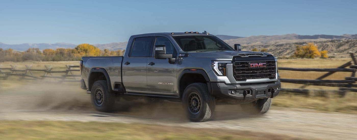 A grey 2024 GMC Sierra 2500 from the side after leaving a used GMC dealer near Five Forks.