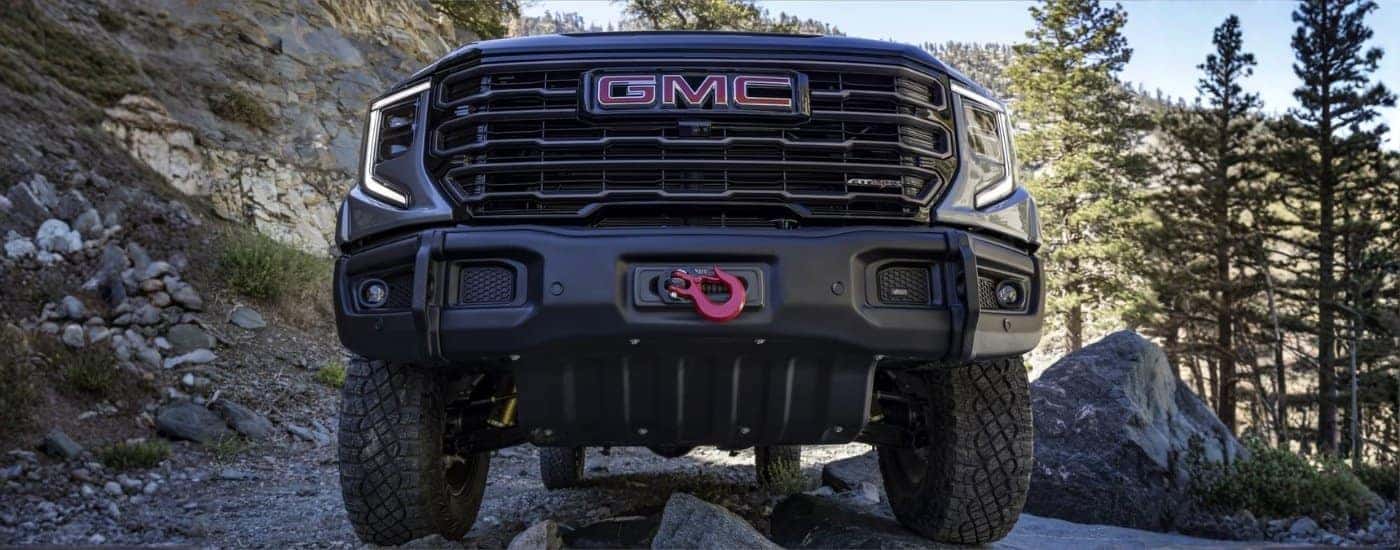 Grey 2023 GMC Sierra 1500 AT4X AEV parked off-road