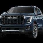 2025 GMC Yukon Dark Blue against a black background