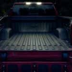 The bed is shown on a red 2024 Chevy Silverado 1500.