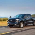 A blue 2023 Chevy Silverado 1500 RST is shown from the front at an angle.