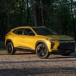 A yellow 2025 Chevy Trax from the side.