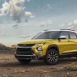 A yellow 2023 Chevy Trailblazer Activ parked off-road.