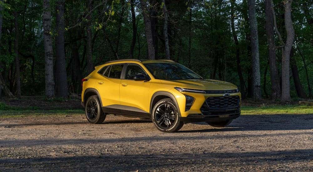 A yellow 2024 Chevy Trax is shown from the front at an angle.