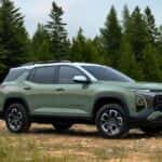 A green 2025 Chevy Equinox parked on a flower field and angled right after visiting a Chevy dealer near Jersey Village.