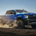 Blue 2026 Chevy Silverado 1500 ZR2 for sale near Houston driving off-road