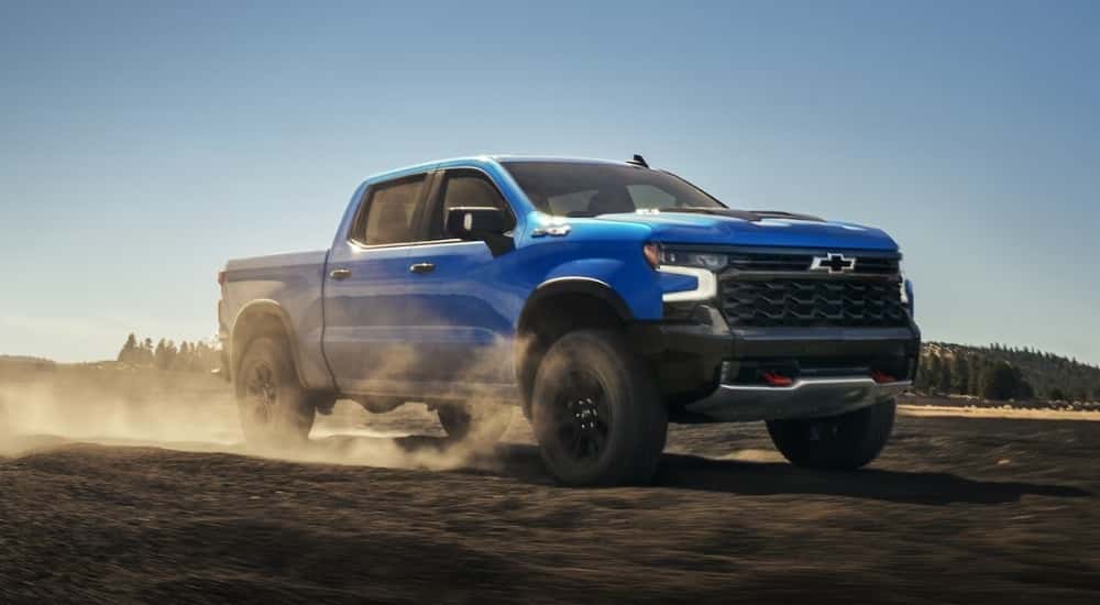 Blue 2026 Chevy Silverado 1500 ZR2 for sale near Houston driving off-road