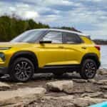 A yellow 2024 Chevy Trailblazer ACTIV parked near a body of water.