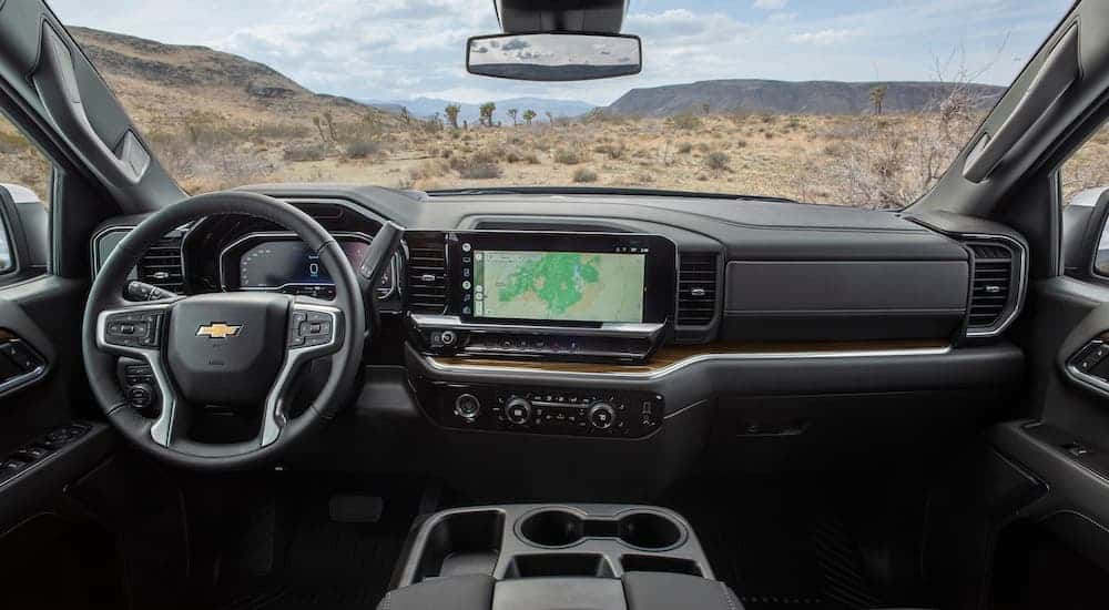 The black interior of a 2023 Chevy Silverado 1500 LT is shown from above the center console.